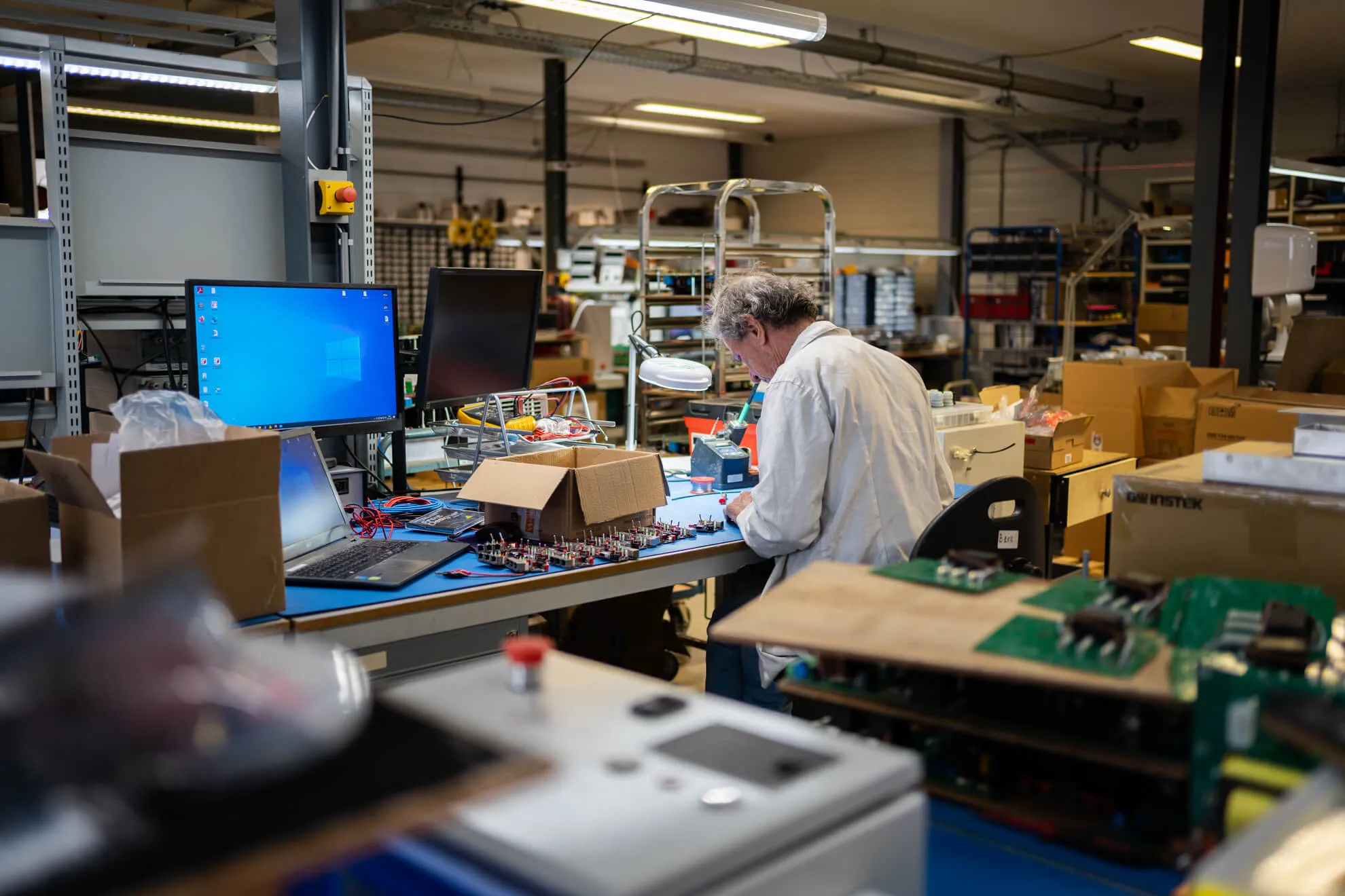 Man working on parts for the Heliox charger